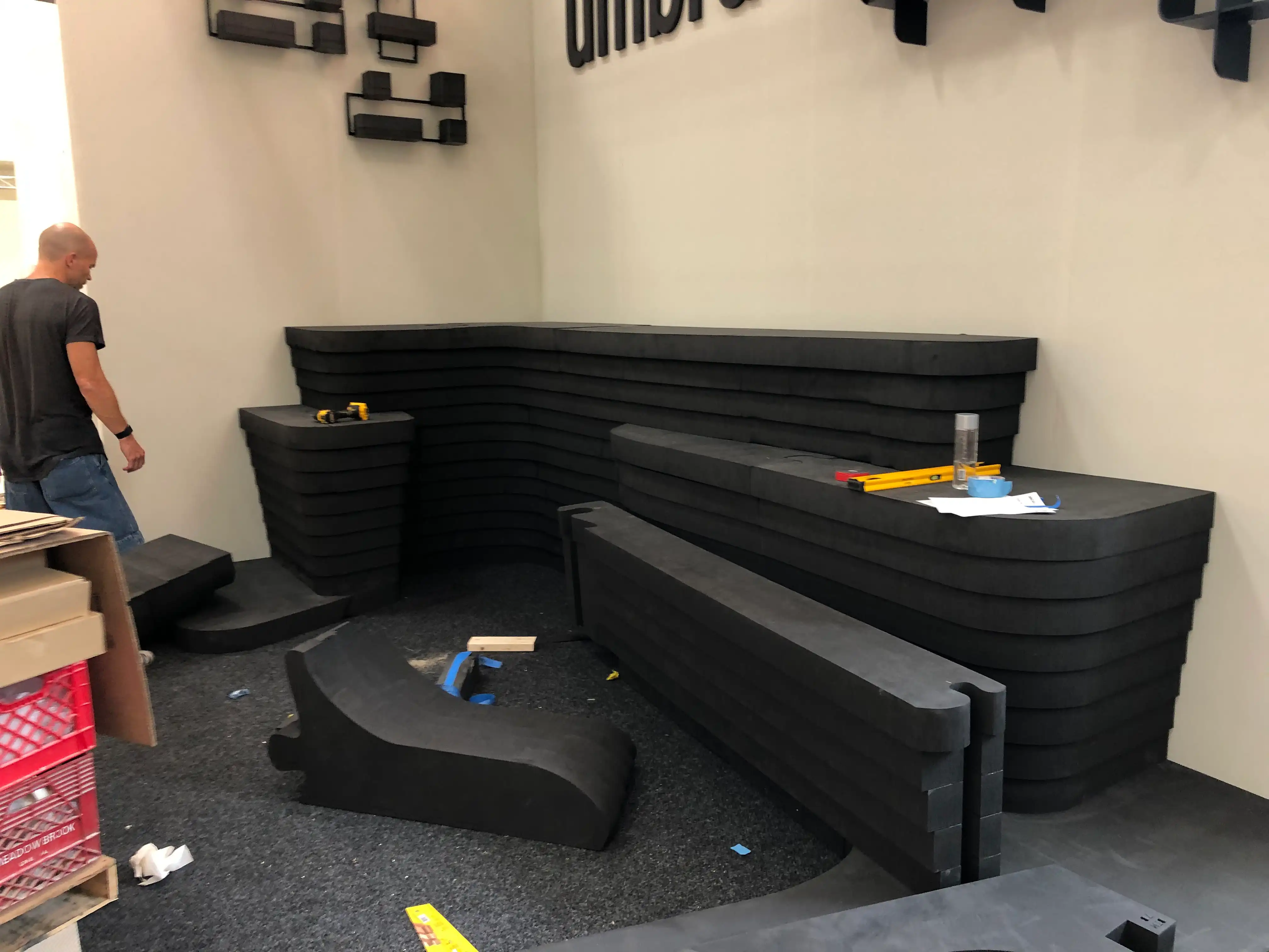 Installing the black foam core booth structure